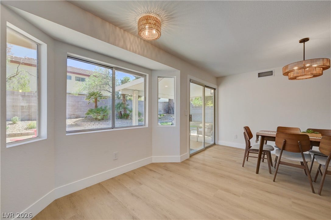 3131 White Rose Way, Henderson, NV 89014 Natural light streams into this versatile space, featuring sleek flooring and outdoor access.
