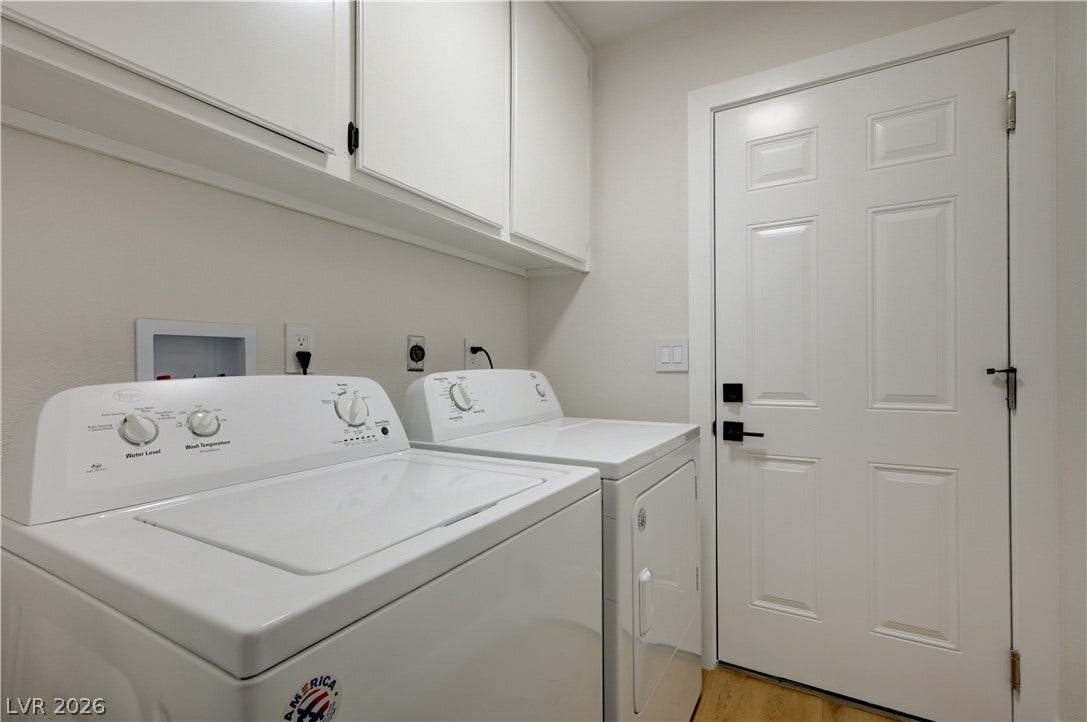 3131 White Rose Way, Henderson, NV 89014 Functional laundry room offers upper cabinetry for convenient storage.
