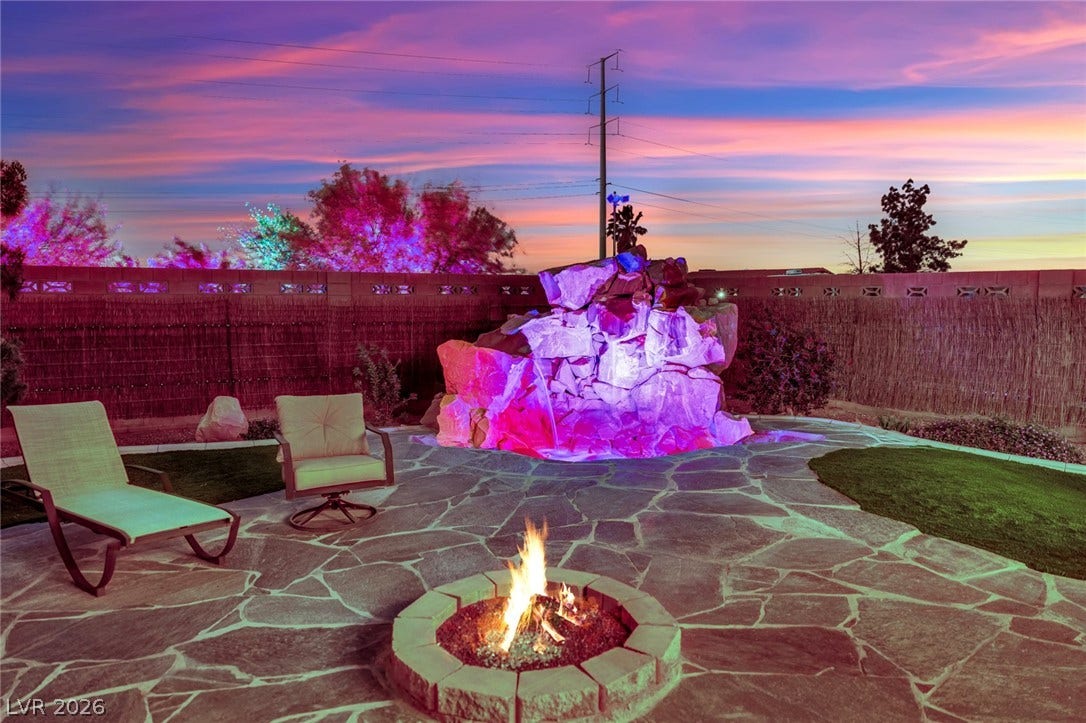 9180 Mohawk Street, Las Vegas, NV 89139 Fenced backyard featuring a patio and a fire pit
