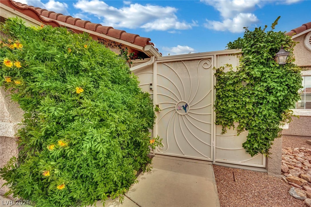9180 Mohawk Street, Las Vegas, NV 89139 Doorway to property with a privacy gate