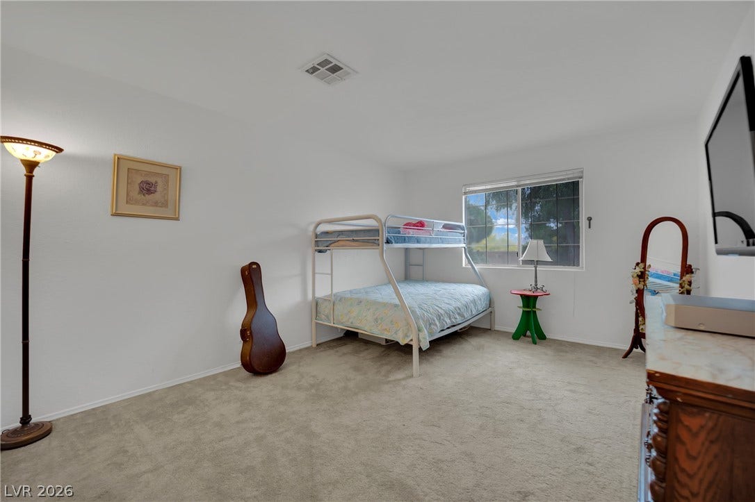 9180 Mohawk Street, Las Vegas, NV 89139 Bedroom featuring light colored carpet