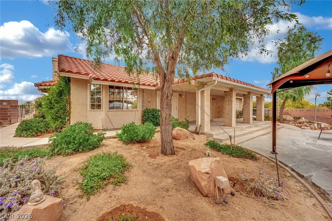 9180 Mohawk Street, Las Vegas, NV 89139 Mediterranean / Spanish-style home with a tile roof and a patio area