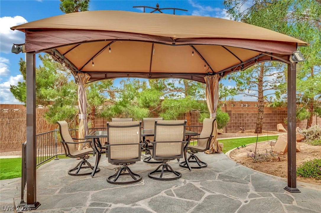 9180 Mohawk Street, Las Vegas, NV 89139 Fenced backyard featuring outdoor dining space, a gazebo, and a patio area
