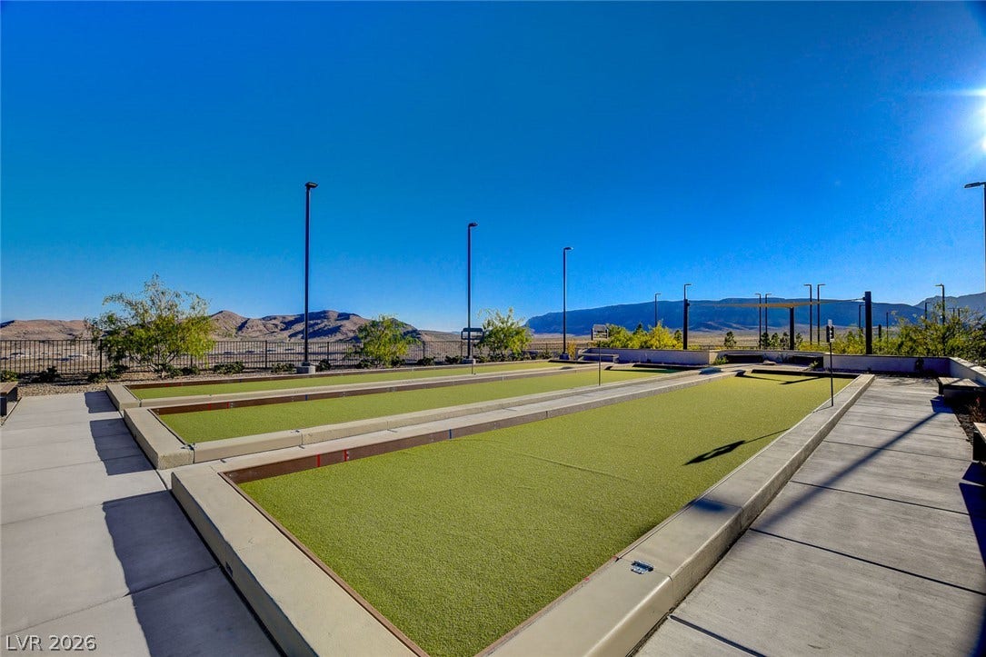 Two bocce ball courts offer an engaging outdoor recreation experience under a wide open sky.