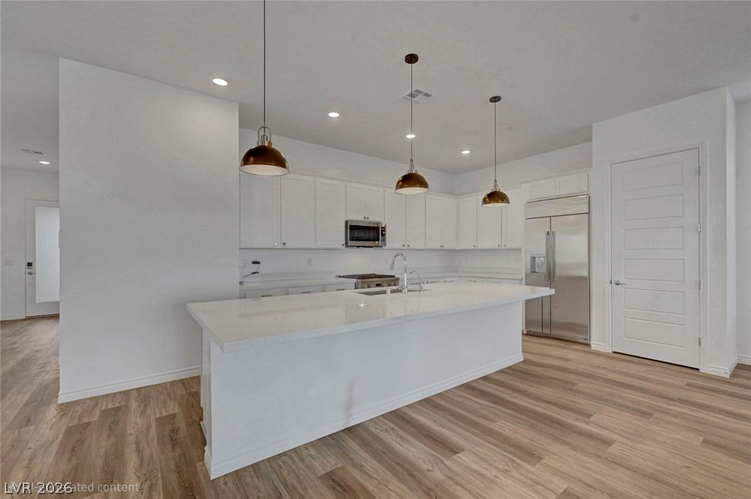 Culinary dreams come alive in this kitchen, boasting abundant counter space and modern appliances.