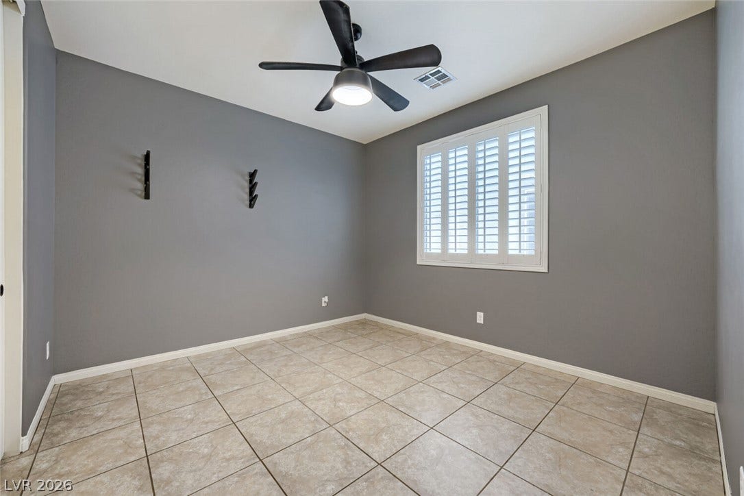 189 Lilt Avenue, Henderson, NV 89011 A well-lit room showcasing a window with plantation shutters and durable tile flooring.