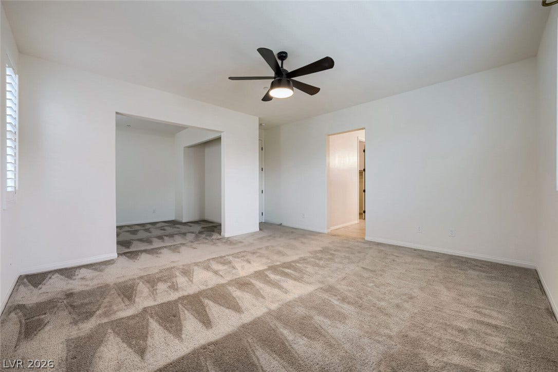 189 Lilt Avenue, Henderson, NV 89011 An inviting room, featuring a fresh coat of paint and soft carpet underfoot, awaits your personal touch.