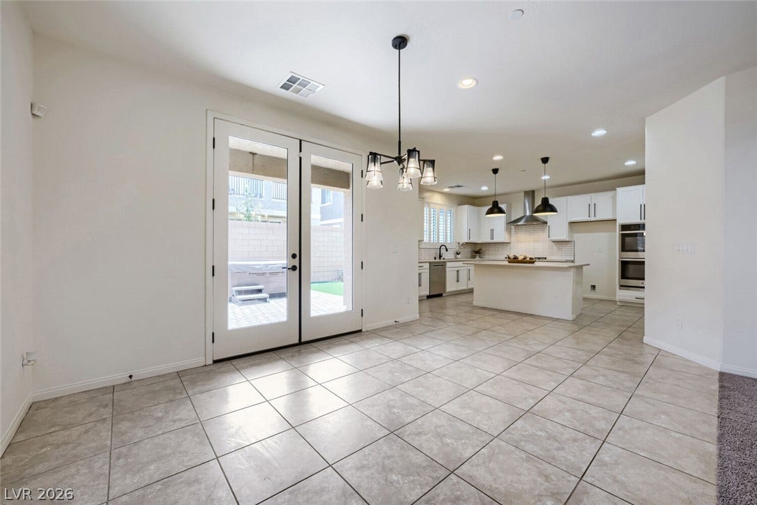 189 Lilt Avenue, Henderson, NV 89011 French doors open to an inviting outdoor space, connecting the airy interior to a private patio.