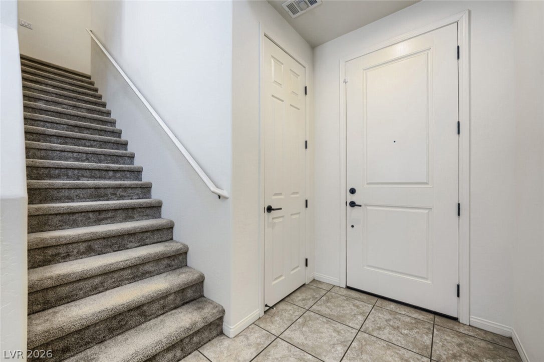 189 Lilt Avenue, Henderson, NV 89011 A welcoming entryway with durable tiled flooring and convenient interior access.