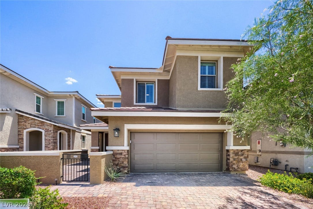189 Lilt Avenue, Henderson, NV 89011 A well-maintained stucco home with stone accents and a paver driveway offers welcoming curb appeal.