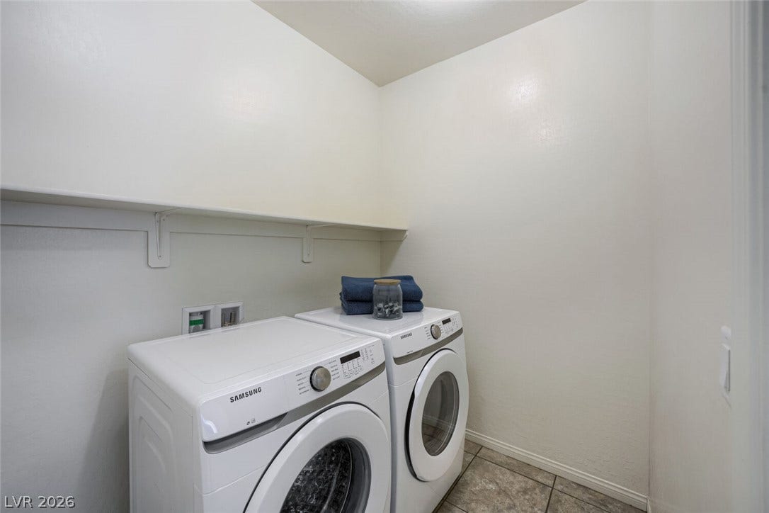 189 Lilt Avenue, Henderson, NV 89011 A dedicated laundry space offers practical and efficient utility with convenient overhead shelving.