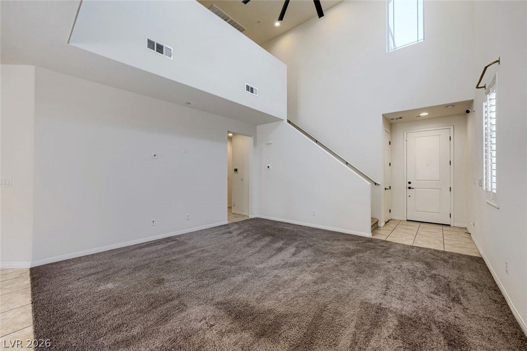189 Lilt Avenue, Henderson, NV 89011 A spacious living area features lofty ceilings and a grand entryway.