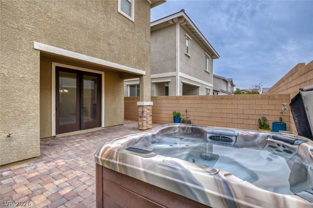 189 Lilt Avenue, Henderson, NV 89011 An inviting private spa awaits on a paved patio, perfect for evening relaxation.