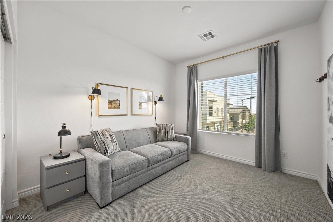 600 N Carriage Hill Drive, #1034, Las Vegas, NV 89138 A versatile room with ample natural illumination, perfect for a guest bedroom or home office.