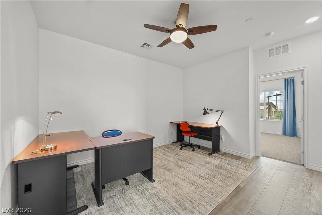 600 N Carriage Hill Drive, #1034, Las Vegas, NV 89138 A quiet work-from-home space featuring a ceiling fan and ample room for multiple desks.