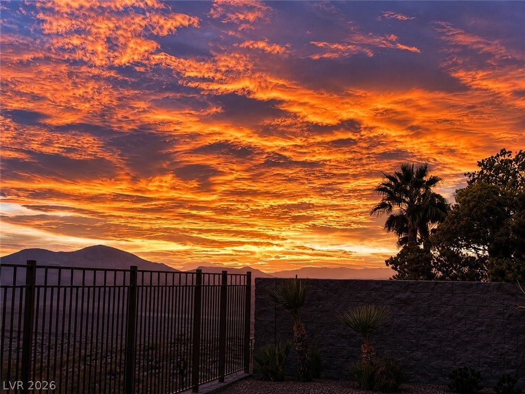 2397 Luberon Drive, Henderson, NV 89044 Witness magnificent sunsets from this home, painting the desert sky in fiery hues.