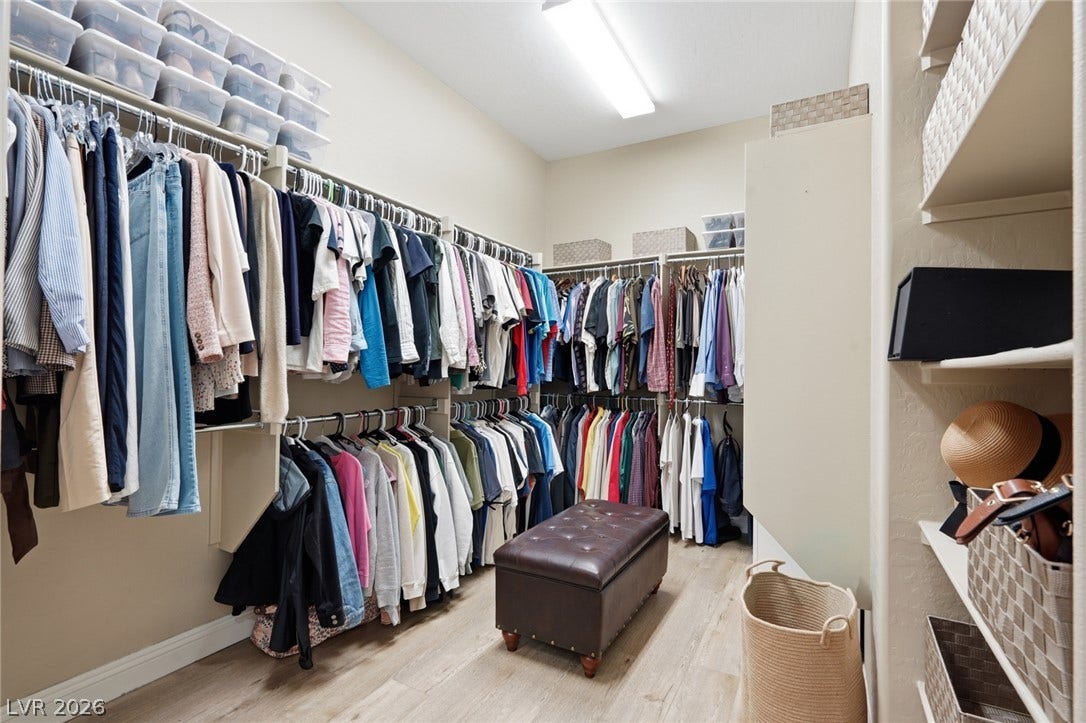 2397 Luberon Drive, Henderson, NV 89044 Ample hanging space and storage solutions elevate this generously proportioned walk-in closet.