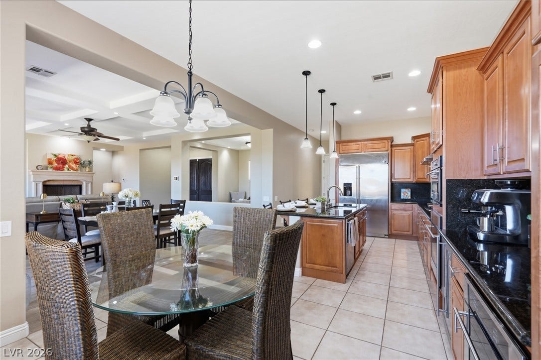 2397 Luberon Drive, Henderson, NV 89044 An open concept design seamlessly connects the dining area to a well-appointed kitchen.
