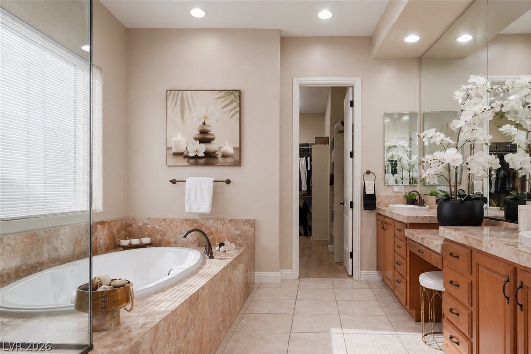 2397 Luberon Drive, Henderson, NV 89044 Indulge in a tranquil primary bathroom, complete with a generous soaking tub and dual vanity sinks.