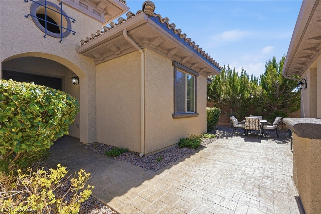 2397 Luberon Drive, Henderson, NV 89044 A private outdoor space with durable concrete paving, ready for al fresco dining and relaxation.