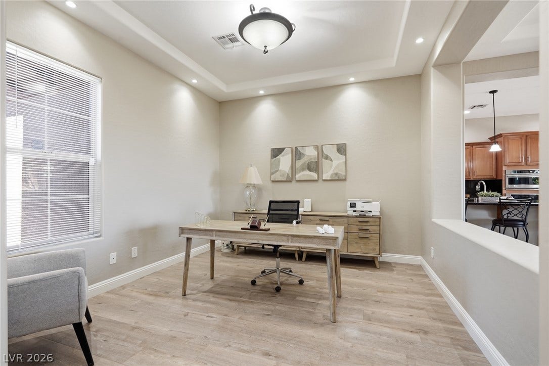 2397 Luberon Drive, Henderson, NV 89044 A well-appointed study features recessed lighting and tray ceilings, offering a perfect work-from-home sanctuary.