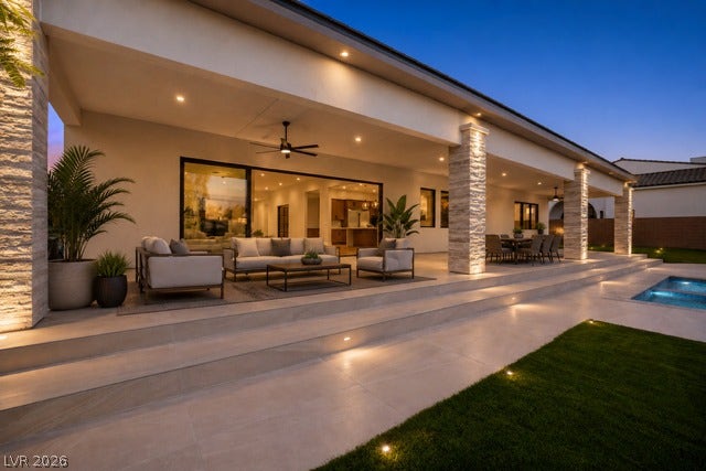 4360 Conough Lane, Las Vegas, NV 89129 Virtually Staged.
An expansive covered patio features clean architectural lines, stone pillars, and smooth tile flooring.