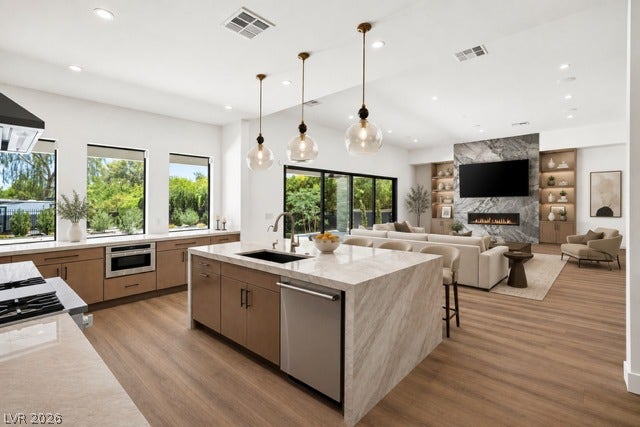 4360 Conough Lane, Las Vegas, NV 89129 Virtually Staged.
Gleaming wood floors anchor an airy, open layout connecting the kitchen to the living room.