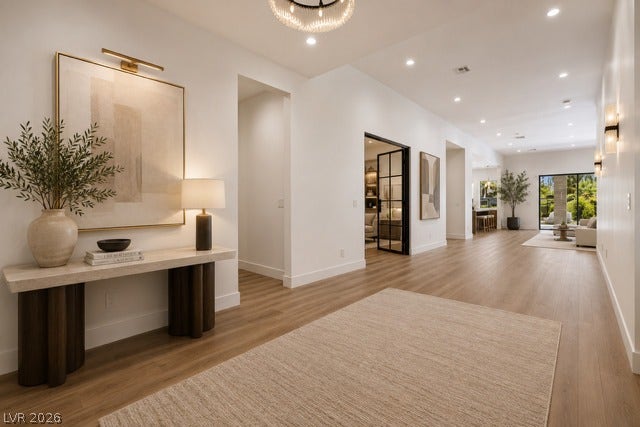 4360 Conough Lane, Las Vegas, NV 89129 Virtually staged. Smooth wood flooring guides the eye through this wide, gallery-style entry hall.