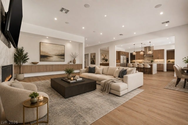 4360 Conough Lane, Las Vegas, NV 89129 Virtually Staged.
An open floor plan connects the living room to a modern kitchen under high ceilings.