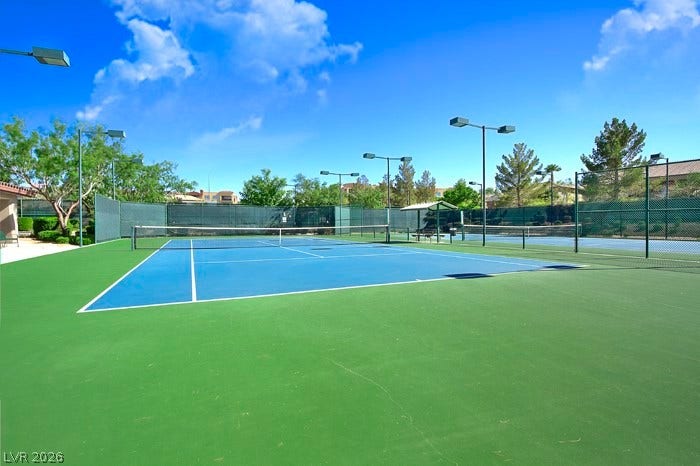 2141 Colvin Run Drive, Henderson, NV 89052 An inviting community outdoor tennis court, perfect for active recreation, offers a vibrant playing surface.