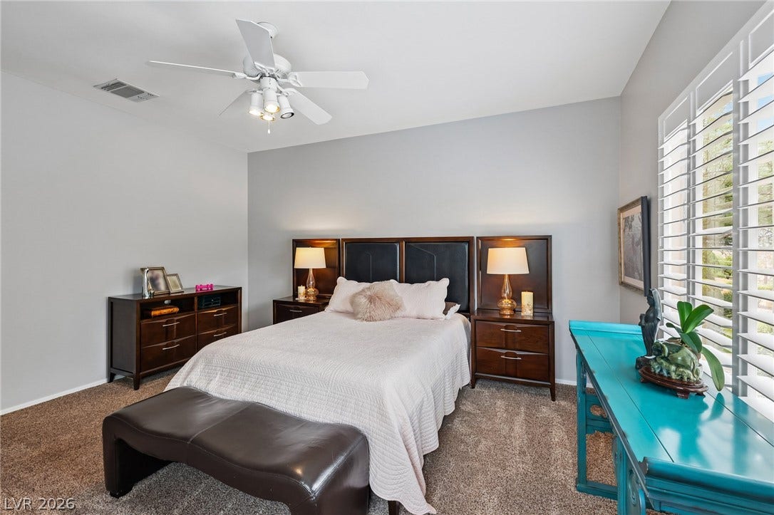 2141 Colvin Run Drive, Henderson, NV 89052 The primary bedroom features ample natural light through well-appointed window shutters.
