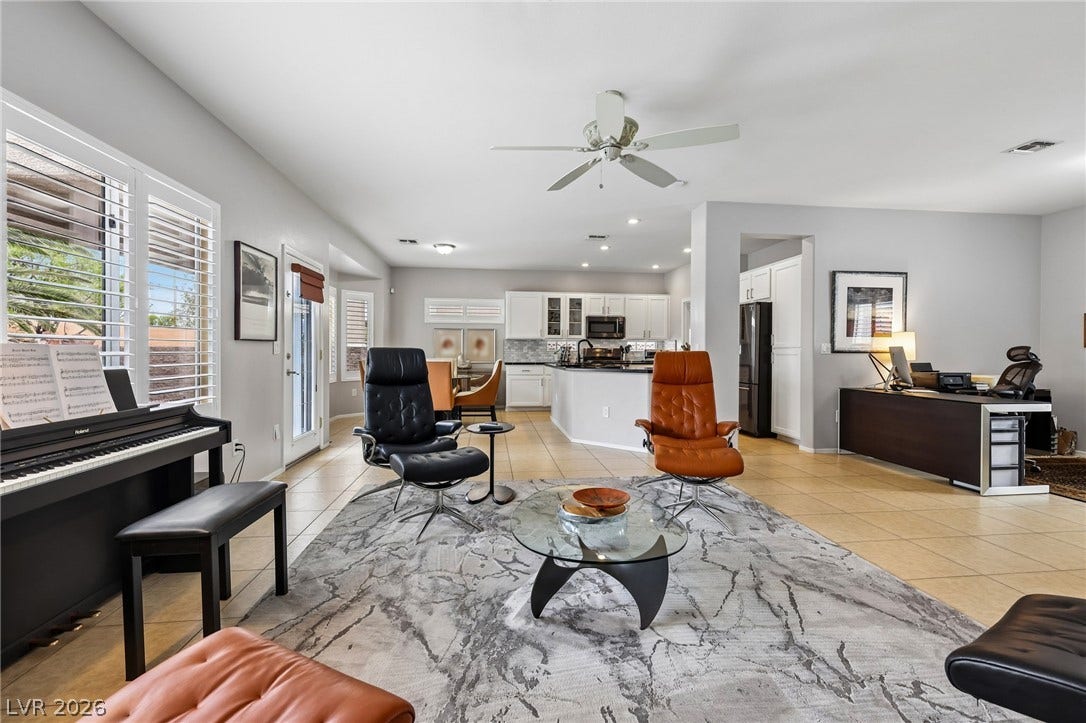 2141 Colvin Run Drive, Henderson, NV 89052 An open concept floorplan seamlessly connects the living room, kitchen, and dining area, ideal for entertaining.