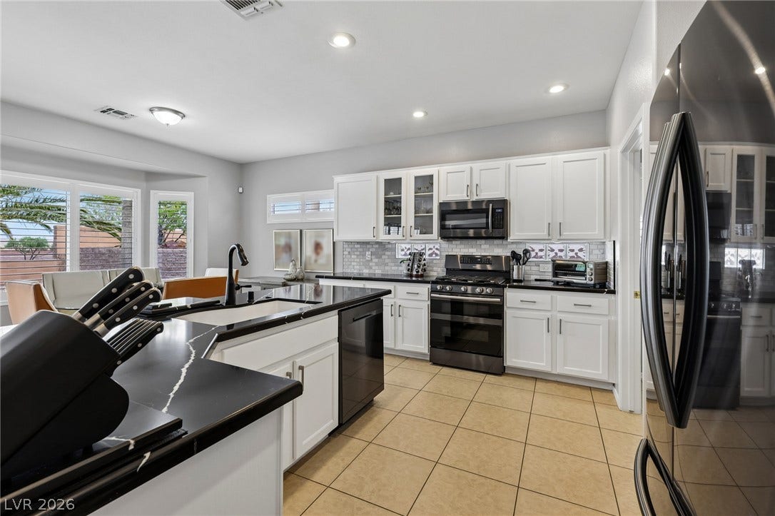 2141 Colvin Run Drive, Henderson, NV 89052 A well-appointed kitchen offers ample counter space and modern appliances for culinary endeavors.