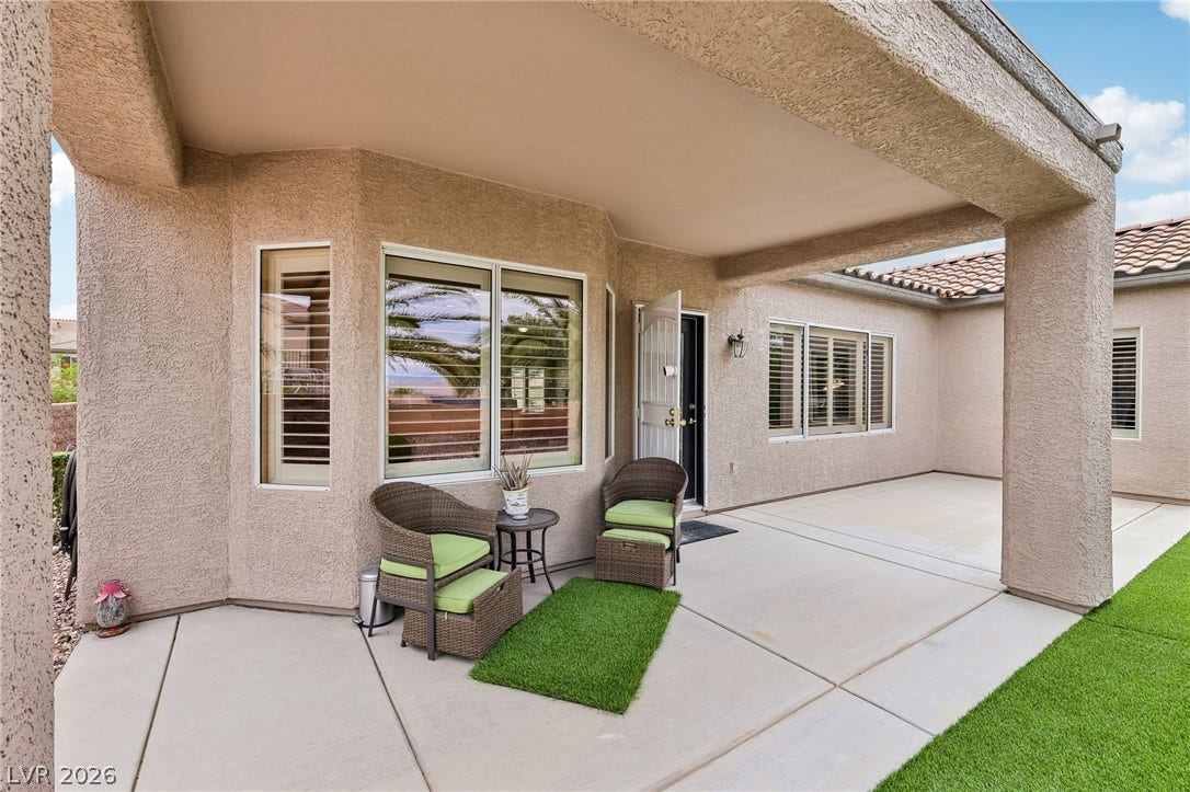 2141 Colvin Run Drive, Henderson, NV 89052 An inviting covered patio offers a comfortable outdoor space, perfect for tranquil moments or entertaining.