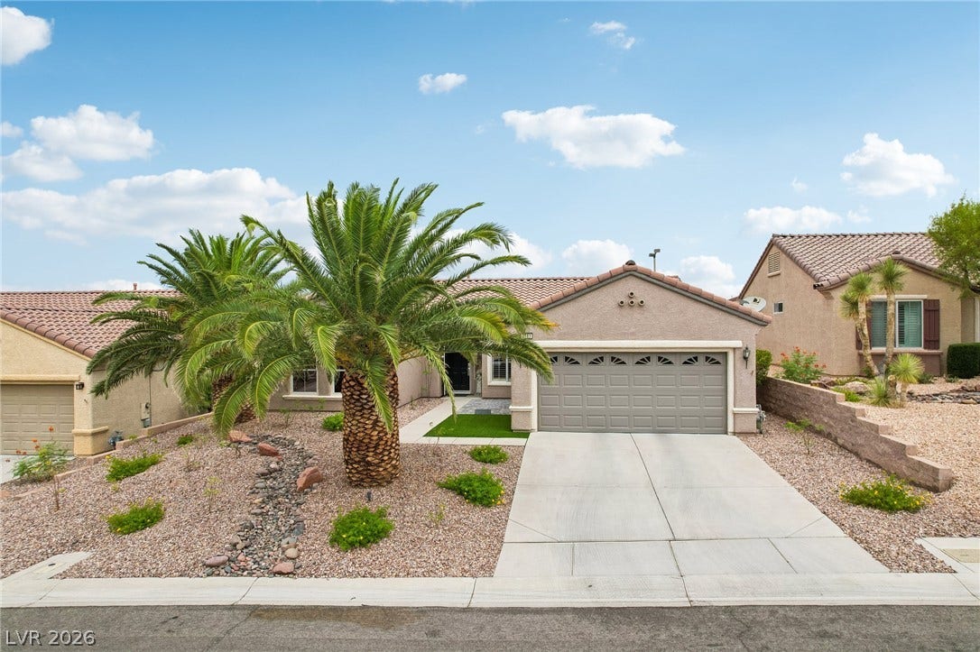 2141 Colvin Run Drive, Henderson, NV 89052 A desert oasis with a well-maintained xeriscaped front yard and an attached garage.