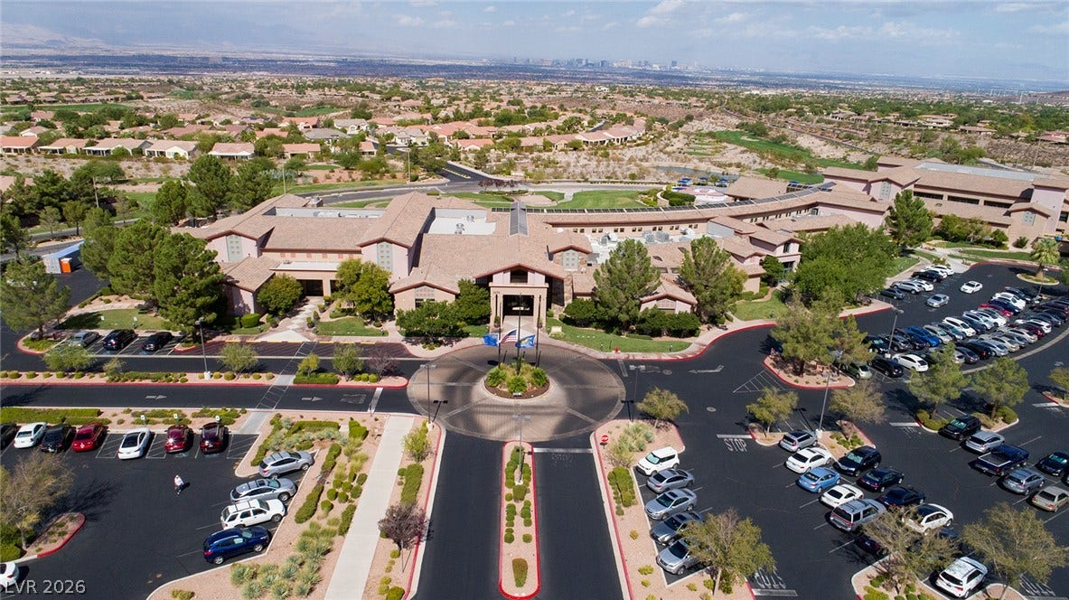 2141 Colvin Run Drive, Henderson, NV 89052 An aerial perspective reveals a vast community complex -- Sun City Anthem's main clubhouse "Anthem Center" amidst abundant parking and green landscaping.