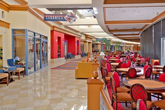 2141 Colvin Run Drive, Henderson, NV 89052 A dynamic commercial space offers multiple seating arrangements, presenting a versatile layout for various activities.