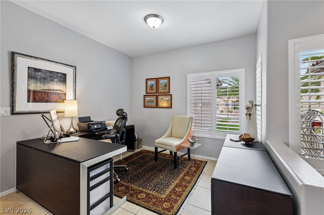 2141 Colvin Run Drive, Henderson, NV 89052 This versatile space, shown here as office, was originally modeled as a dining room by the Builder, but many owners use it as an office, or extra sitting area.