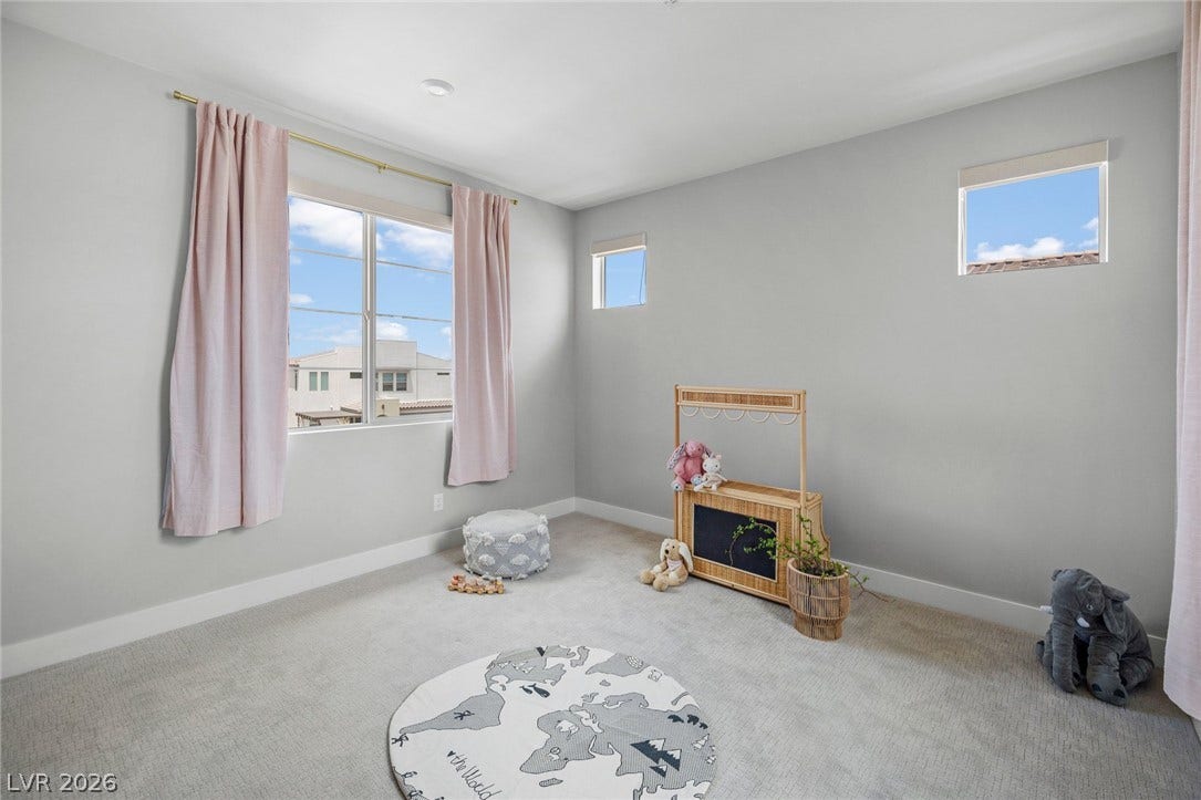 3194 Poplar Crest Court, Henderson, NV 89044 A well-lit bedroom provides a serene atmosphere for rest and play.