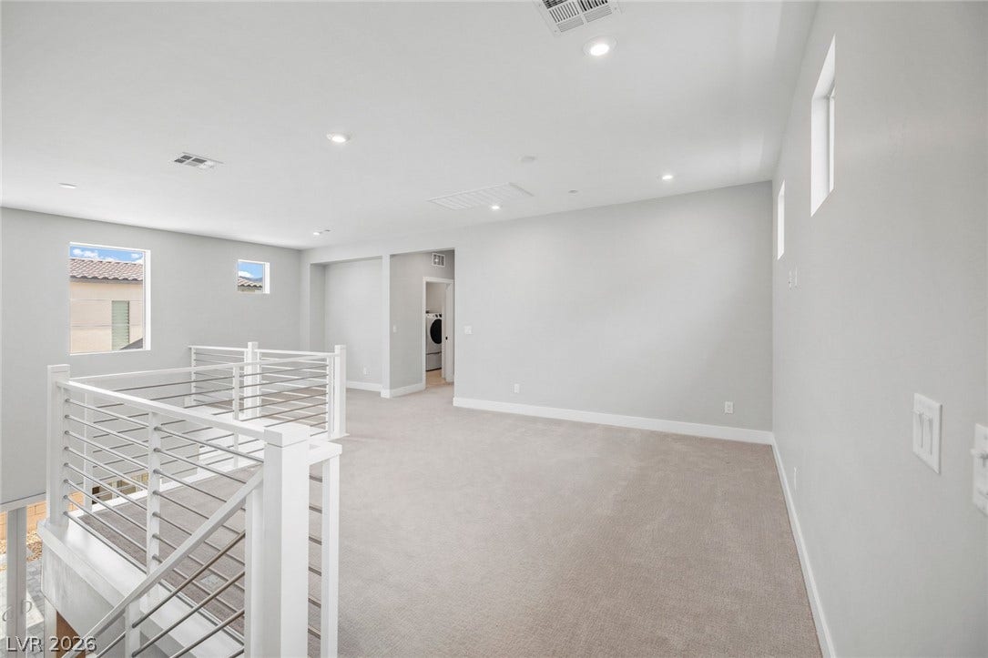 3194 Poplar Crest Court, Henderson, NV 89044 A spacious upper-level area offers natural light and a dedicated laundry alcove.