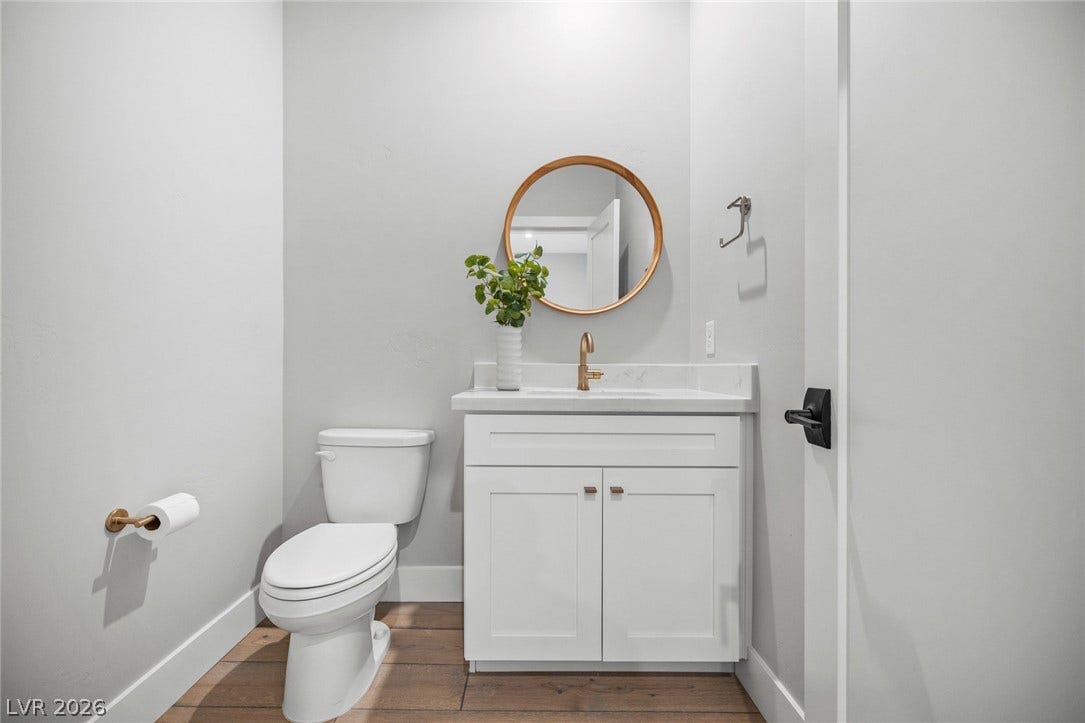 3194 Poplar Crest Court, Henderson, NV 89044 A well-appointed half-bath with a stylish vanity and clean-lined fixtures.