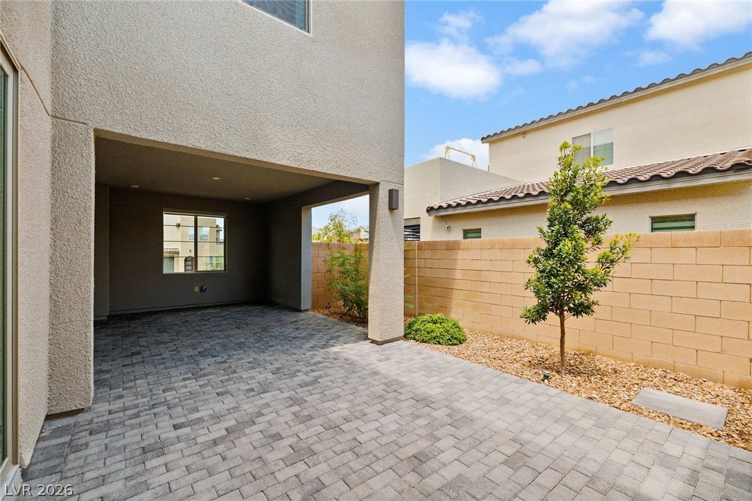 3194 Poplar Crest Court, Henderson, NV 89044 A spacious covered patio features elegant paver flooring and ample room for outdoor relaxation.