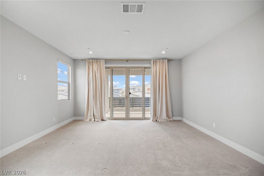 3194 Poplar Crest Court, Henderson, NV 89044 A spacious room offers ample natural light and a private balcony.