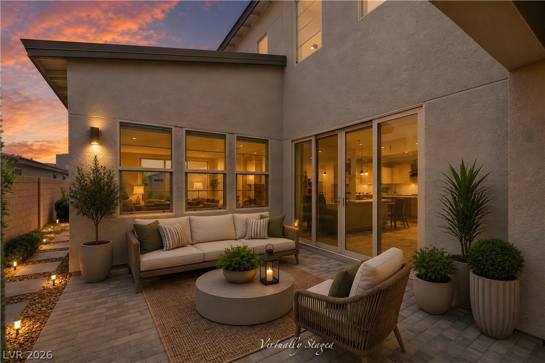 3194 Poplar Crest Court, Henderson, NV 89044 An inviting stone-paved patio connects seamlessly to the interior through large sliding glass doors.