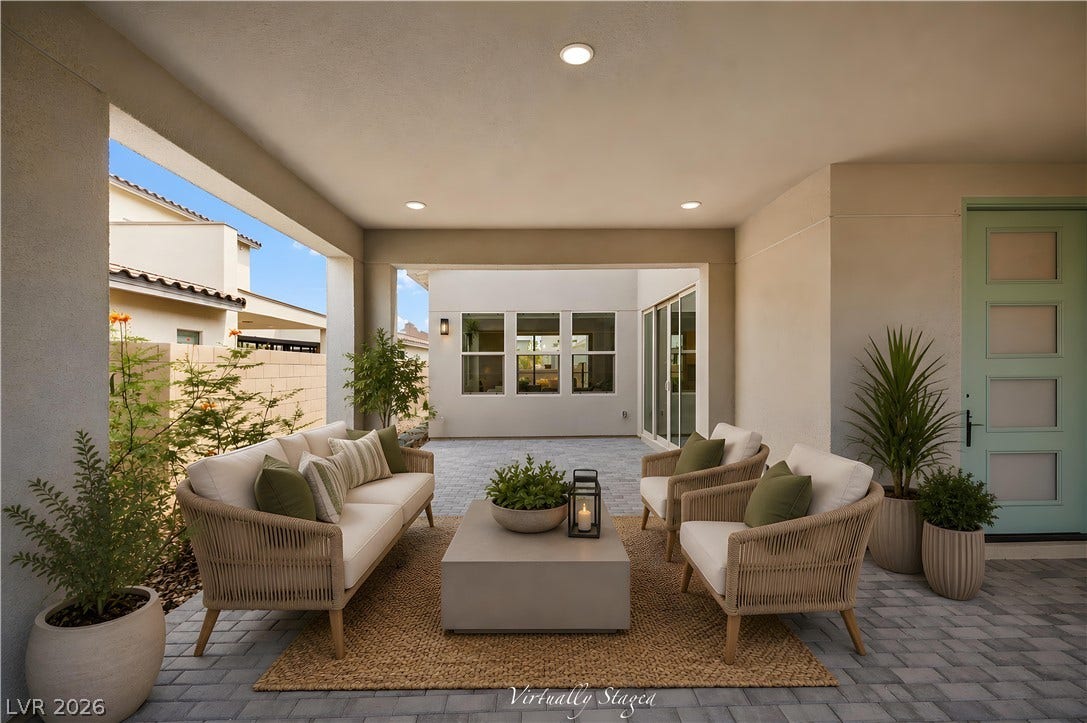 3194 Poplar Crest Court, Henderson, NV 89044 Sheltered outdoor living space connects seamlessly to a paved courtyard under recessed lighting.