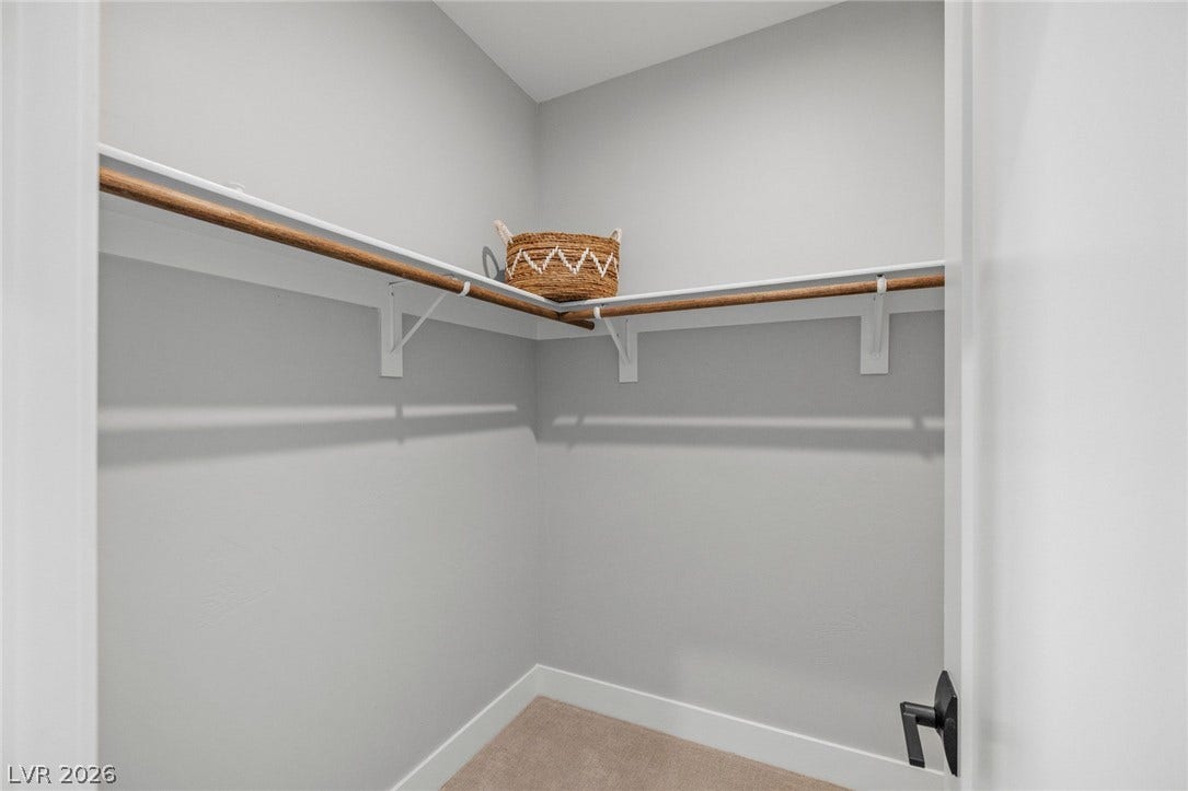 3194 Poplar Crest Court, Henderson, NV 89044 Ample hanging and shelf space define this well-appointed, functional walk-in closet.