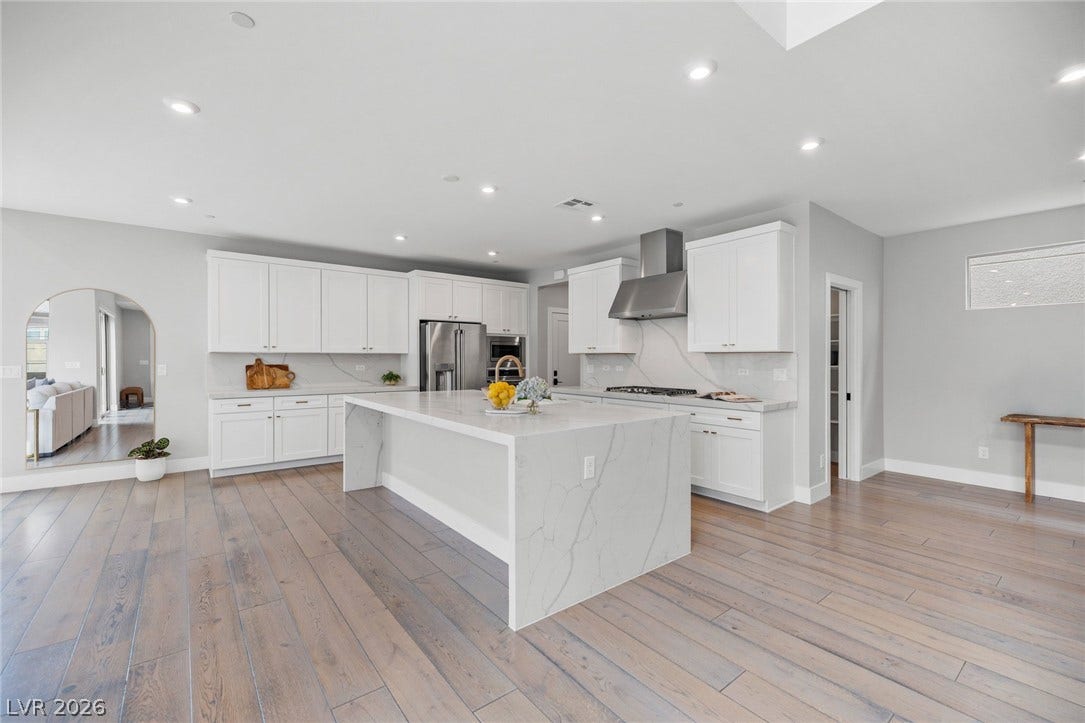3194 Poplar Crest Court, Henderson, NV 89044 Bright, open-concept kitchen features a spacious island and gleaming stainless steel appliances.