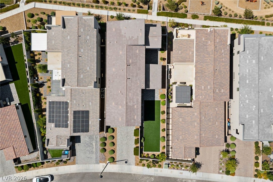 3194 Poplar Crest Court, Henderson, NV 89044 An aerial perspective reveals a contemporary neighborhood with structured landscaping and efficient solar panels.