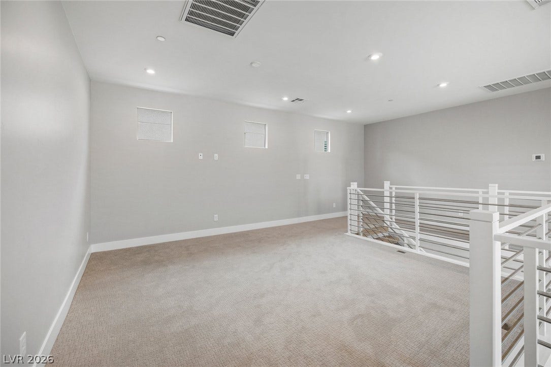 3194 Poplar Crest Court, Henderson, NV 89044 A spacious, naturally illuminated loft area boasts a contemporary railing design and ample recessed lighting.