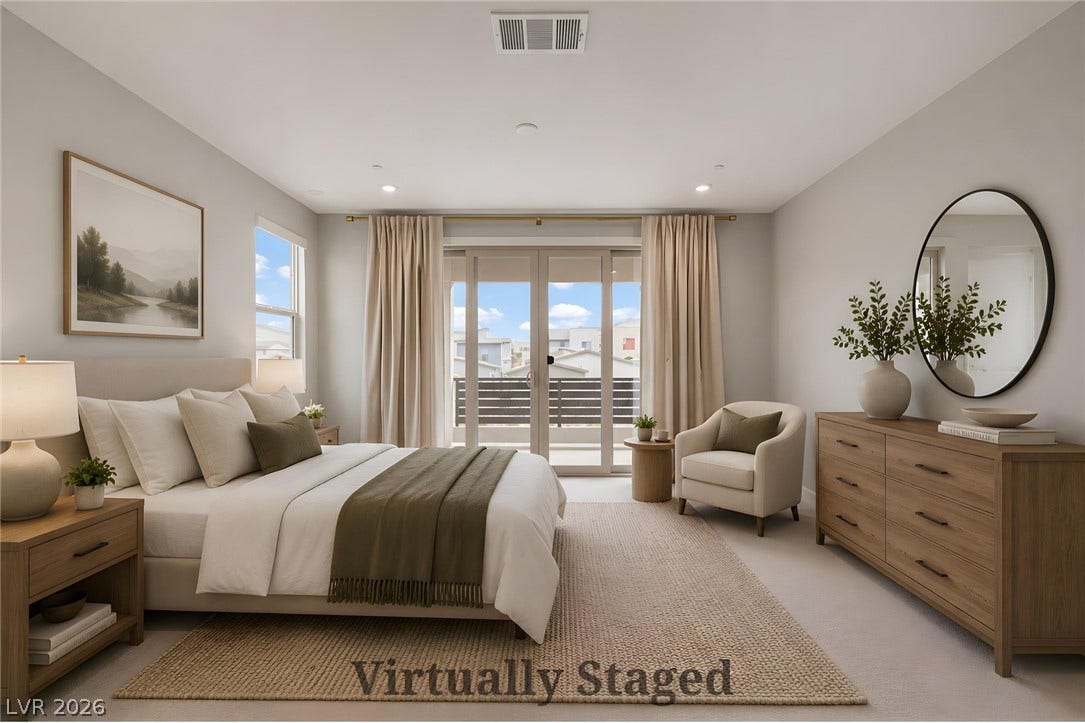 3194 Poplar Crest Court, Henderson, NV 89044 A well-lit bedroom features sliding glass doors opening to a private balcony, enhancing the inviting atmosphere.